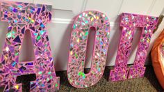 the letters are made out of plastic and have holographics on them,