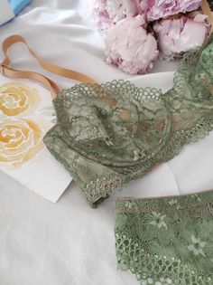 Green lingerie set    Adjustable gold straps. Brazilian panties classic fit. Elastic lace.  Sits well on the buttocks   The set can be worn daily and for special events. For example, on a date, a walk, a movie and anywhere.  Unusual color for your beauty   If you have any questions, write to me. I will help you choose the size and the most beautiful lingerie for you.  With love, Anastasia Feminine String Bra With Delicate Lace, Elegant String Bra For Wedding, Elegant String Bra, Elegant Fitted String Bra, Elegant String Wedding Bra, Elegant Wedding String Bra, Fitted String Bra With Lace Closure, Elegant Underwire Bra With Boning, Elegant Green Bra With Padded Cups