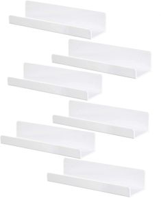 four white shelfs are stacked on top of each other