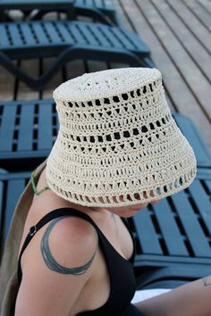 Embrace the latest trend with our handmade, unique Raffia Bucket Hat. Crafted from 100% environmentally friendly raffia yarn, this hat provides excellent sun protection while being incredibly light and comfortable. It's designed to keep you cool and prevent sweating even in the hottest weather. Perfect for poolside lounging, beach days, city outings, or any hot summer activity, this Raffia Bucket Hat effortlessly complements your trendy look. Versatile in style, you can wear it as a classic bucket hat or fold the brim up to sport a sailor hat look. MATERIAL: 100% natural raffia SIZE: Diameter: 20 cm (7.8 inches), suitable for standard adult size. COLOR: Personalize your hat by choosing your favourite colour, 14 colours available: Ivory; White Oak; Daffodil; Lemon; Green Tea; Mineral Green; Handmade Cream Straw Hat With Short Brim, Crochet Yarn Hats For Vacation, Crochet Cotton Yarn Vacation Hats, Beach Hand Knitted Yarn Hat, Hand Knitted Yarn Beach Hats, Hand Knitted Yarn Hats For Beach, Hand-knitted Yarn Hat For Beach, Beach Crochet Hat Hand Knitted, Hand-knitted Crochet Hat For Beach