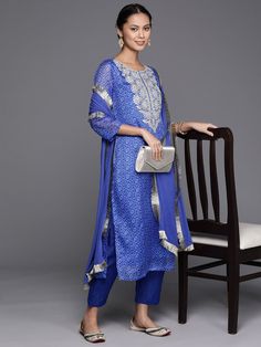 Grab this beautiful 3-piece set. The set comes with bandhani print & embroidered kurta has round neck, 3/4th sleeves & calf length teamed with solid trouser pant with elasticated waistband and a slip-on closure and a silk chiffon dupatta with lace detailing. Color - Blue Kurta Fabric-Cotton Blend Bottom Fabric-Cotton Blend Dupatta Fabric - Silk Chiffon Neck-Round Neck Sleeves-3/4th Sleeves Work - Bandhani Print & Embroidery Detailing Washing Instructions-Hand Wash DISCLAIMER - The color of the p Bandhani Print, Blue Kurta, Formal Jewelry, Print Embroidery, Embroidery Detailing, Chiffon Dupatta, Fabric Silk, Churidar, Suit Set