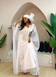 Whether you're attending a special event or celebrating life's moments, this agbada makes you feel rich in culture and style. Make a statement, exude confidence, and embrace the richness of tradition with this timeless piece. White Agbada, African Kaftan Dress, Boubou Gown, Woman Embroidery, Bubu Dress, African Couture, African Kaftan, Bubu Gown Styles, Africa Clothing