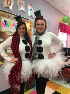 two women dressed up as snowmen in costumes