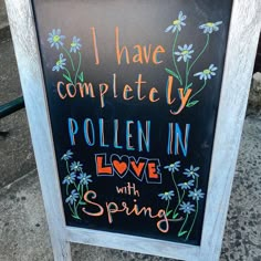 a chalkboard sign that says i have completed my pollen in love with spring