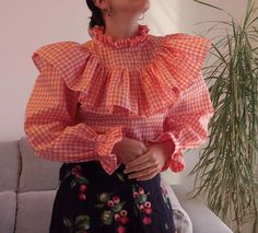 "Handmade orange gingham ruffles top. Oversize frills ruffles long sleeve shirt blouse. Size S. Measurements lying flat> Bust: 18\"/46cm Length: 22\" / 56cm Sleeve length: 22,8\" 58cm" Chic Orange Cotton Blouse, Trendy Orange Cotton Blouse, Trendy Ruffled Lantern Sleeve Tops, Orange Long Sleeve Blouse With Ruffles, Chic Orange Ruffled Blouse, Plaid Long Sleeve Blouse With Ruffles, Long Sleeve Ruffled Blouse With Relaxed Fit, Ruffled Long Sleeve Relaxed Fit Blouse, Chic Orange Blouse With Ruffles