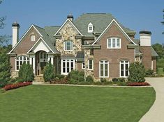 a large brick house with lots of windows