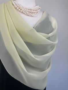 Elevate your style with our exquisite collection of chiffon shawls. Our chiffon shawls are the epitome of elegance and versatility, designed to effortlessly enhance your wardrobe and leave a lasting impression. Made from the fine poly chiffon fabric, these shawls offer a delicate and airy drape that adds a touch of grace to any outfit. Whether you're attending a special occasion, a casual gathering, or simply want to elevate your everyday look, our chiffon shawls are the perfect accessory. Choos Elegant Cream Scarf For Formal Occasions, Elegant White Dupatta For Evening, Silk Shawl Scarf For Wedding, Elegant Sheer Dupatta Shawl, Silk Wedding Shawl Scarf, Elegant Cream Silk Dupatta, Elegant Cream Silk Scarf As A Gift, Elegant Cream Shawl Scarf, Elegant Cream Silk Scarf As Gift