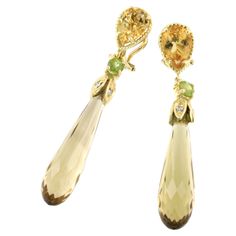 Classical designs with natural stones , suitaible for any occasion. Made in Italy by Stanoppi Jewellery since 1948 Earrings in 18k yellow gold with Wisky Citrine (long drop cut, size: 3,00cm), Citrine (drop cut, size:7x10 mm), Peridot (round cut size: 3,00mm) and white Diamonds cts 0.08 VS colour G/H. All Stanoppi Jewelry is new and has never been previously owned or worn. Each item will arrive at your door beautifully gift wrapped in Stanoppi boxes, put inside an elegant pouch or jewel box. Luxury Yellow Gold Peridot Jewelry, Elegant Luxury Peridot Earrings, Luxury Yellow Gold Peridot Earrings, Luxury Yellow Gold Citrine Earrings, Luxury Peridot Multi-stone Jewelry, Elegant Pouch, Classic Earrings, Jewel Box, G H