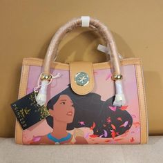 a handbag with an image of a woman's face on the front and side