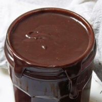 a jar of chocolate spread sitting on top of a towel