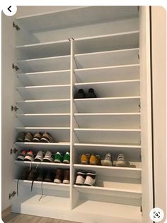 a white closet with several pairs of shoes on the bottom shelf and two rows of shelves below