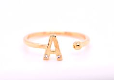 This ring makes a perfect gift for multiple occasions. Made to order in solid 14kt gold you can choose from yellow gold, white gold or rose gold when ordering. Studded with a lovely white diamond for that touch of sparkle. Minimalist in style this makes a simple statement. Get it in Mom's initial or with the letter M for a perfect Mother's Day gift. Perfect also for a promise ring or an engagement ring in your fiance's initial. This ring also makes a great gift for loved ones on birthdays and an Adjustable 14k White Gold Initial Ring, Gold Initial Ring With Single Diamond Gift, Adjustable Yellow Gold Initial Ring In Sterling Silver, Adjustable Yellow Gold Sterling Silver Initial Ring, Gold Initial Open Ring With Single Diamond, Gold Initial Ring With Single Diamond, Adjustable Initial Ring In Yellow Gold, Adjustable Yellow Gold Initial Ring Fine Jewelry, Gold Open Ring With Single Diamond Initial