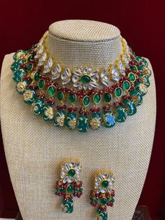 Kundan necklace choker . Premium quality uncut kundan work , semi precious stone setting with crystal drops . Kundan worked tumble bead work. Comes with matching earring. Bollywood Emerald Necklace For Festive Occasions, Bollywood Style Festive Emerald Necklaces, Bollywood Style Festive Emerald Necklace, Green Jeweled Kundan Necklace For Party, Green Kundan Necklace For Party, Green Kundan Bridal Necklace With Stone Work, Festive Green Hand Set Kundan Necklace, Green Emerald Kundan Necklace With Stone Work, Green Jeweled Kundan Necklace For Festivals