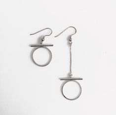 Asymmetrical Omega symbol earrings in gold or silver finish. Modern and minimal style that would compliment an everyday casual outfit or a little black dress as well. The earwires are 925 Sterling silver or silver plated for the silver finish or raw brass ball post for the gold finish. ►Length: long earring- 2 1/2inch (6.5cm) // short earring- 1 1/3inch (3.5cm) ►Your earrings come beautifully gift wrapped and ship within 1-3 business days of purchase. ►More Ear Jacket designs see here: https://w Omega Symbol, Symbol Earrings, Jacket Designs, Black Tourmaline Ring, Letter Symbols, Long Earring, Mineral Jewelry, Everyday Casual Outfits, Triangle Studs