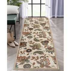 a white rug with floral designs on it