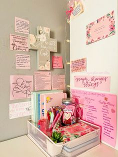 a white desk topped with lots of pink items