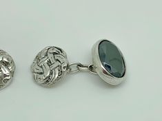 A stylish pair of vintage sterling silver cufflinks in detailed iona zoomorphic celtic knot design and set with a faceted oval cut hematite in the other ends. Maker/Markings: Marked SILVER Condition: Very Good Used Condition, general wear/patina -  Please look at photos Measurements: Iona end 12mm & Hematite End 15 x 11mm Weight: 8.9g Celtic Knot Sterling Silver Cufflinks, Celtic Knot Designs, Knot Design, Silver Cufflinks, Tie Accessories, Celtic Knot, Cuff Links, Vintage Sterling Silver, Oval Cut