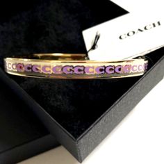 New Coach Women's Bangle Bracelet Plated Color Pink And Gold Coach Adjustable Bangle, Adjustable Coach Bangle, Coach Gold Bangle Bracelet, Coach Metal Bangle Jewelry, Formal Adjustable Coach Bracelets, Pink Metal Bangle Bracelet, Coach Jewelry Bracelet Gift, Coach Bracelet Jewelry Gift, Coach Adjustable Bracelet As Gift