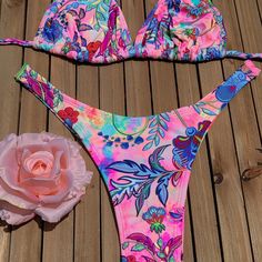 Brazilian Bikini In Small, Medium, And Large. Color Is As Pictured. Vibrant Pink Printed Swimwear, Vibrant Pink Floral Print Swimwear, Vibrant Pink Triangle Top Swimwear, Vibrant Red Swimwear For The Beach, Vibrant Red Swimwear For Beach, Vibrant Red Swimwear For Beach Party, Colorful Summer Party Swimwear, Colorful Swimwear For Beach Season Party, Red Floral Print Triangle Top Swimwear