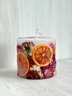 a candle that has some fruit on it