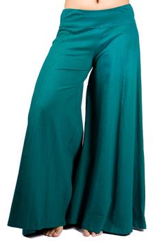 "Palazzo style pant, fitted at waist via elastic, flows out in an A-shape. Stretchy and comfortable. Long inseam and long legged. Looks like a skirt! Free flowing and wonderful to dance in. Pair with one of our crop tops for a classic Mishu style outfit! Approximate measurements: XS: Inseam: 29\" Hip: 34-40\" Waist:28-32\" Length 39\" S: Inseam: 30\" Hip: 36-42\" Waist:30-36\" Length 39\" M: Inseam: 31\" Hip: 38-46\" Waist: 32-40\" Length 39\" L: Inseam: 31\" Hip: 42-48\" Waist: 34-42\" Length 4 Relaxed Fit Full Length Bottoms, Loosely Fitted Green Wide Leg Pants For Fall, Relaxed Fit Full Length Bottoms With Wide Waistband, Relaxed Fit Full Length Pants With Wide Waistband, Green Full-length Bottoms For Fall, Green Full Length Bottoms For Fall, Baggy Full Length Pants With Elastic Waistband, Stretch Cotton Full-length Bottoms, Green Full-length Parachute Pants For Fall