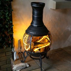 an old fashioned stove is lit up with flames