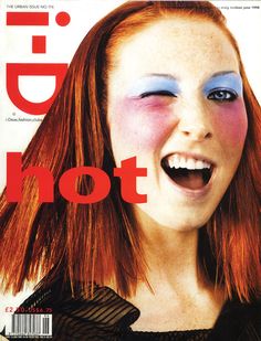 a woman with red hair and blue eyes on the cover of magazine's latest issue