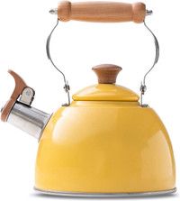 a yellow tea kettle with a wooden handle is shown against a white background and has a clipping on the top