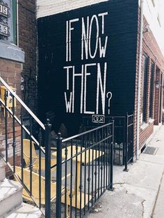 graffiti on the side of a building that says if not then? in black and white