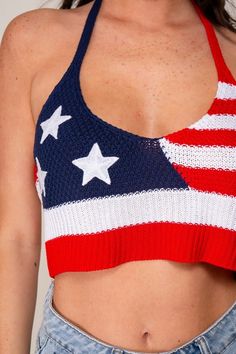 This Red Navy USA Sweater Halter Crop Top features a USA flag design and a sleeveless halter design, perfect for celebrating the 4th of July. Ideal for game day, summer events, or patriotic holidays. Add a touch of pride to any occasion with this top. Fabric & fit: Model is wearing size small. American Flag Print Cotton Top For Beach, Casual Tops For 4th Of July Beach Outing, Casual Beach Tops For 4th Of July, White American Flag Print Top For The Beach, White American Flag Print Top For Beach, White American Flag Print Tops For Beach, White Tops With American Flag Print For Beach, Red Tops For Summer Sports Events, Red Summer Tops For Sports Events