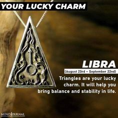 a silver necklace with an image of a triangle and the words libra on it