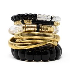 Stack of 5 Includes: Gold Sophie Bracelet Black Vinyl 6mm Clear + Black Bracelet Black Bangle 20mm Clear Zo Stack of 3 Includes: Gold Sophie Bracelet Black Vinyl 6mm Clear + Black Bracelet Adjustable Black Bracelet, Modern Black Bangle Jewelry, Black Jubilee Style Bangle Bracelet, Stackable Black Beaded Bracelets, Modern Black Bangle With Jubilee Bracelet, Modern Black Bangle, Black Luxury Stackable Jewelry, Black Stackable Fine Jewelry, Modern Black Round Bangle