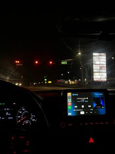 the dashboard of a car at night time