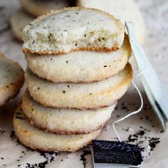 a stack of cookies sitting on top of a table next to a tag with a string