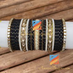 Golden Black Polki Kundan Bangle Set can be customized with any Bangle or Kada. - Talk to us to Add or Remove any bangle and adjust pricing. - Price shown is for Both Hands Explore more INDIAN BANGLES, Indian Kada, CHURA, Bridal Kada 👉 PUNJABI BRIDAL JEWELLERY ONLINE 💁🏻‍♀️Kamalika, US ⭐️⭐️⭐️⭐️⭐️ Great collection. Prompt delivery. Exceeded my expectations- more beautiful than the picture. Love the packaging which comes with a 'Thank You' note. Great customer care. Very happy with whatever I pu Traditional Black Bracelets For Party, Traditional Black Party Bracelets, Handmade Adjustable Black Bangle, Adjustable Handmade Black Bangle, Adjustable Black Handmade Bangle, Black Bracelets For Festivals, Black Festive Bracelets For Festivals, Traditional Black Bracelets For Weddings, Traditional Black Bracelet For Wedding