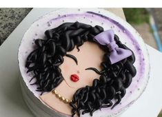 there is a cake decorated with a woman's face