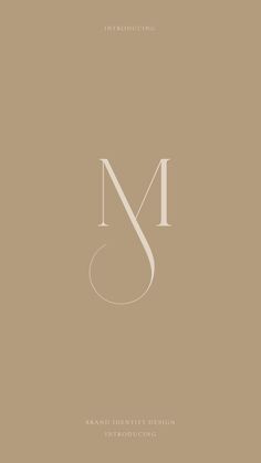 the letter m is made up of two lines and has an elegant monogramic design