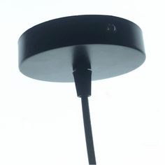 a close up of a black lamp on a white background with the light turned off