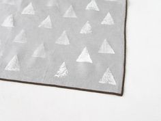 a piece of cloth with white triangles on it