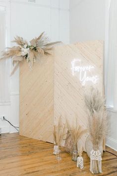 a sign that says forget you on it next to some dried flowers and other decorations