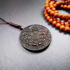 ❤This unique melong badge was collected from Rejia Monastery.It's a Astrology Protective Amulet Pendant,made of thokcha and carved 2 sided pattern.The shape is Tibetan Budhist amulet badge - SIPAHO.The front is calendar pattern, and the back is elephant.You can make it into pendant ,keychain,bag hanging, or just put it on your desk,as amulet.It Is Believed That The SIPAHO is a sacred chart with the symbols of Tibetan astrology, including its Tibet and Chinese forming with the image of “magic squ Handmade Amulet Necklaces For Puja, Rectangular Amulet Necklace For Meditation, Rectangular Amulet Pendant For Meditation, Protective Amulet, Hand-strung Amulet Mala For Meditation, Tibetan Prayer Beads, Pendant Keychain, Buddhist Symbols, Astrological Symbols