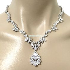 "A piece of woodland wedding nature inspired statement bridal necklace featuring vines, leaves parts and flower pendant, made of sparkly clear cubic zirconia. This beautiful cz jewelry comes in tarnish-resistant silver rhodium plated chain. Necklace length options: - 17\" (43cm) with a snap clasp - 19\" (48cm) including a 2\" chain extender on a spring clasp (as shown on display). View matching pieces or similar designs at https://etsy.me/2eR38KG View designs related to vines, branches, twigs or Classic Diamond Necklace With Rhinestones For Wedding, Classic Rhinestone Diamond Necklace For Wedding, Classic Wedding Diamond Necklace With Rhinestones, Glamorous Crystal Diamond Necklace For Wedding, Wedding Crystal Diamond Necklace, Wedding Crystal Diamond Necklace With Sparkling Detail, Wedding Crystal Diamond Necklace Sparkling, Classic Crystal Diamond Necklace For Wedding, Glamorous Bridal Necklace With Sparkling Stones For Anniversary