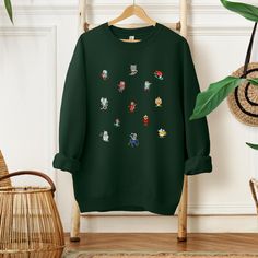 Get ready to hit the slopes in adorable style with our Cute Animal Ski Sweatshirt! This winter wonder showcases cute little animals hitting the slopes, adding a whimsical touch to your skiing adventures. Made from soft and cozy fabric, this sweatshirt is perfect for showcasing your love for both winter sports and charming critters. Embrace the snowy vibes with our playful and stylish Animal Ski Sweatshirt - where cute meets comfort on the slopes!Designed with a perfect blend of soft cotton and breathable polyester, this classic heavy-blend crewneck sweatshirt fits comfortably and is great for warm weather. The side seams are also stitched to prevent irritation. - Composed of a blend of 50% cotton and 50% polyester, creating a strong and smooth fabric ideal for printing - Medium-heavy fabri Winter Character Print Long Sleeve Tops, Winter Long Sleeve Tops With Character Print, Winter Crew Neck Sweatshirt With Cartoon Print, Winter Cartoon Print Crew Neck Sweatshirt, Winter Cotton Sweater With Character Print, Winter Long Sleeve Sweatshirt With Character Print, Cotton Winter Sweater With Character Print, Winter Crew Neck Sweatshirt With Character Print, Winter Long Sleeve Sweater With Character Print