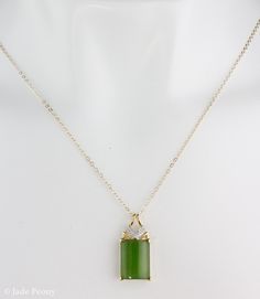 "Here is a AAA grade Siberian emerald green nephrite jade set in solid 18KT yellow gold and accented with round full cut white diamonds. This pendant is designed with a chevron accent. It is modern with simple clean lines. The jade is natural and untreated. This nephrite jade has a beautiful glowing apple green color. Stone & Dimensions: Natural Untreated gem grade AAA Siberian Emerald Green Nephrite Jade: approximately 11.2 carats 16mm long x 12mm wide x 5mm thick, Overall size of pendant: Green Rectangular Stone Jewelry For Formal Occasions, Formal Green Jewelry With Rectangular Stone, Green Rectangular Necklace For Formal Occasions, Formal Green Rectangular Necklace, Elegant Rectangular Jade Necklace, Elegant Green Rectangular Emerald Necklace, Formal Jade Jewelry For May Birthstone, Elegant Dark Green Jade Jewelry, Formal Rectangular Jade Jewelry