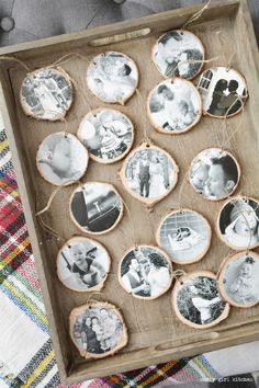 a wooden box filled with different pictures on top of a table