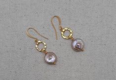 Cultured beige/ blush pink coin pearls dangle from textured plated gold discs. Plated gold French ear wires. Length is near 2 in. Coin Pearls are 1/2 inch diameter. Perfect gift for birthday, Anniversary, Mother's Day, or Valentine's Day. Beautiful bride or bridesmaid earrings for traditional or boho chic wedding. Gifting storage box included with purchase. Adjustable Gold Pearl Earrings For Party, Gold Pearl Earrings Nickel Free For Party, Gold Nickel-free Pearl Earrings For Party, Gold Pearl Earrings For Party, Nickel Free, Nickel-free Gold Pearl Earrings For Wedding, Gold Nickel-free Pearl Earrings, Gold Hammered Dangle Pearl Earrings, Pine Jewelry, Christmas Circle