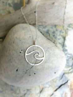 Handcrafted Sterling silver round wave, lightly flattened and hammered  hanging on an 18 inch sterling silver necklace Simple, lightweight, elegant This pendant measures approx. 3/4 inch in diameter Sterling Silver Wavy Necklace For Gifts, Silver Wavy Necklace For Gift, Everyday Silver Jewelry With Wavy Design, Everyday Silver Jewelry With Wavy Shape, Everyday Silver Wavy Jewelry, Handmade Silver Wavy Jewelry, Silver Open Circle Hammered Jewelry, Pierced Pendant, Silver Jewlery