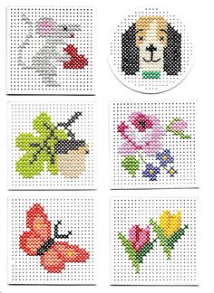 four different cross stitch designs with flowers and dogs in the middle one has a dog on it