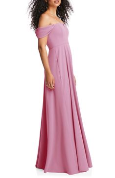 a woman in a long pink dress