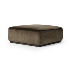 a square footstool with a dark brown velvet finish and wooden legs, on an isolated white background